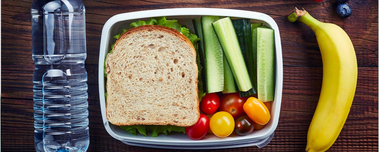 Healthy school lunch with sandwich and fruit