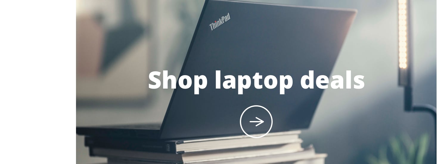 Lenovo thinkpad on a stack of books