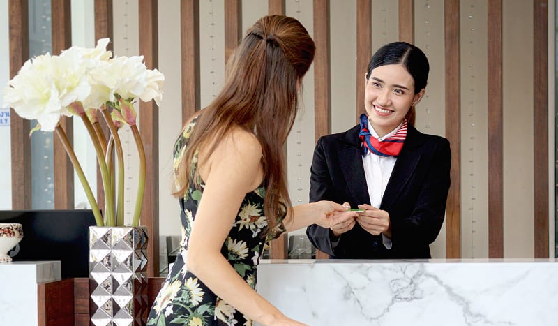 Woman checking into hotel