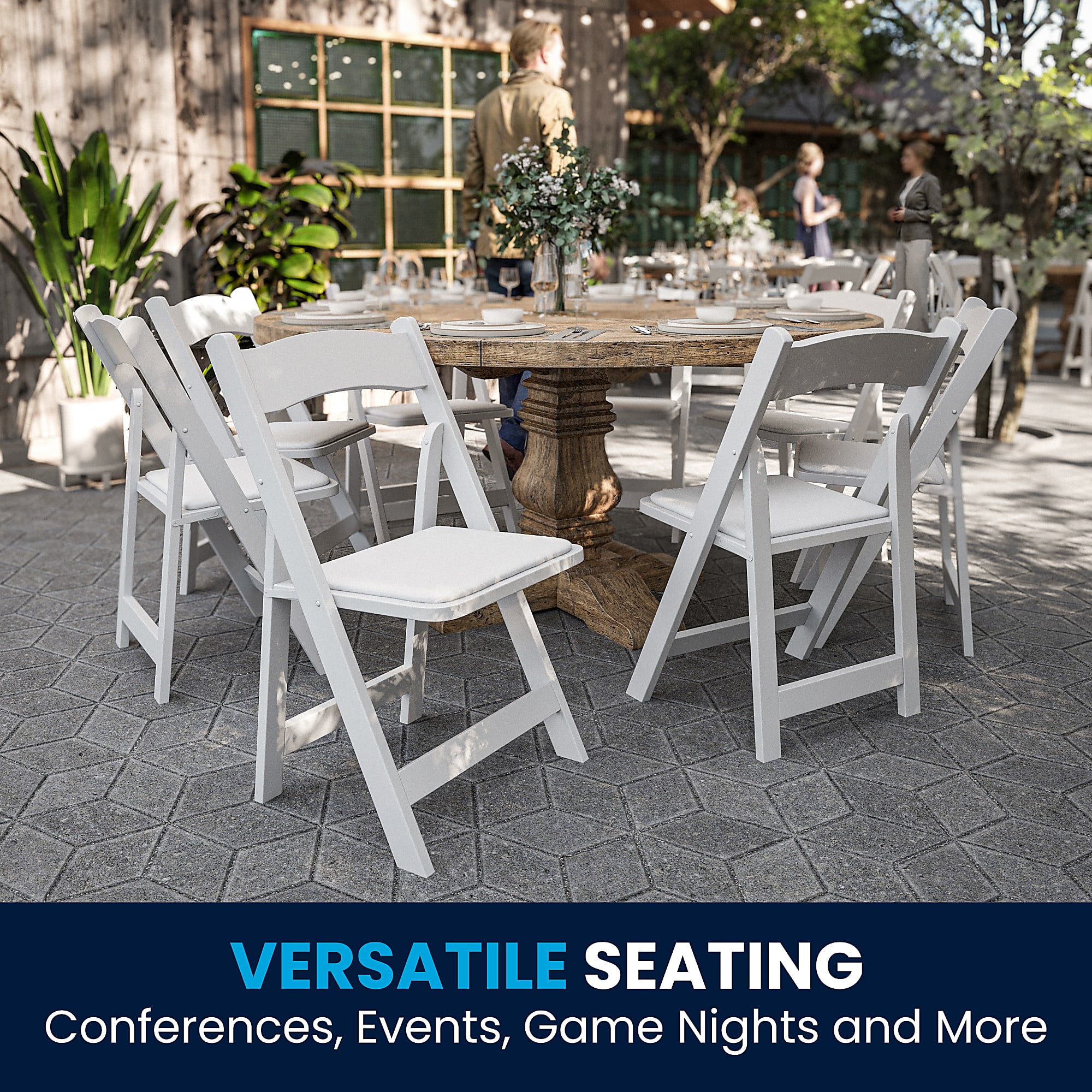 Multiple white folding chairs surrounding a wooden table outdoors.