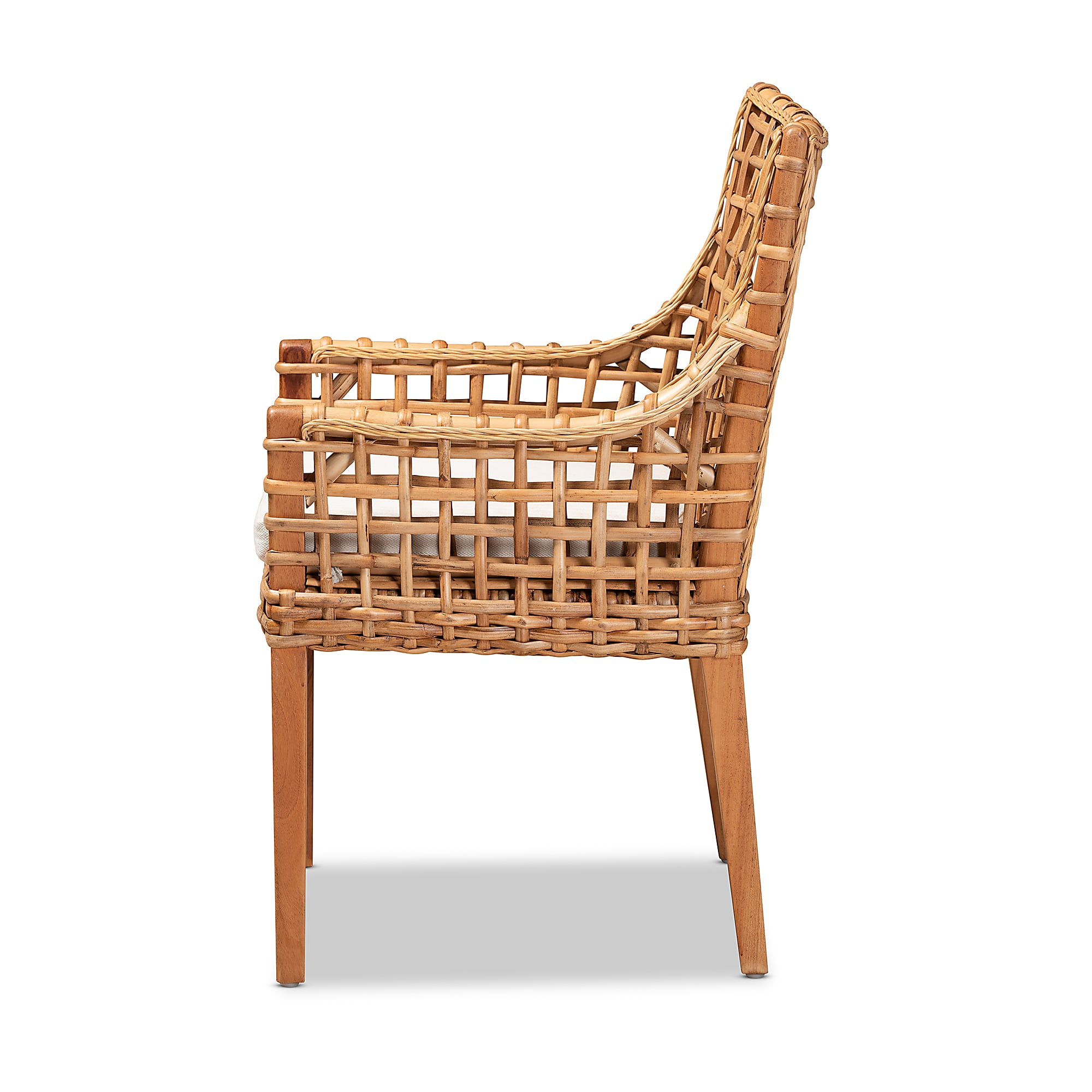 Natural brown and white rattan dining chair with a white seat cushion.