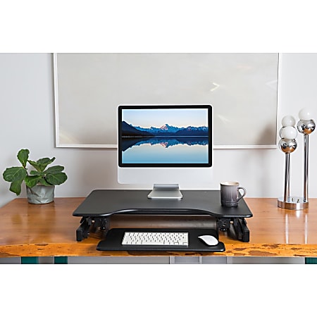 Lorell Adjustable Desk Riser Plus 34 12 W x 27 D Black - Office Depot