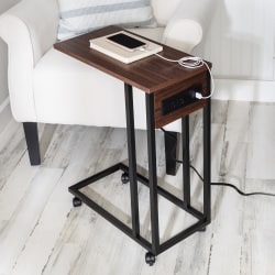 This c shaped side table is a modern Jack-of-all-trades. It not only looks stunning sitting beside a sofa with its rich walnut top and black metal legs, but it is a dream when it comes to everything from lounging to laptop work.